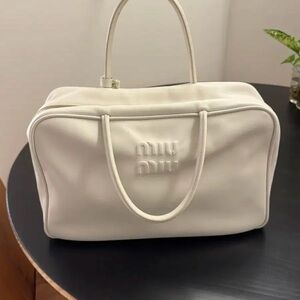 Miu Miu embossed-logo leather tote bag